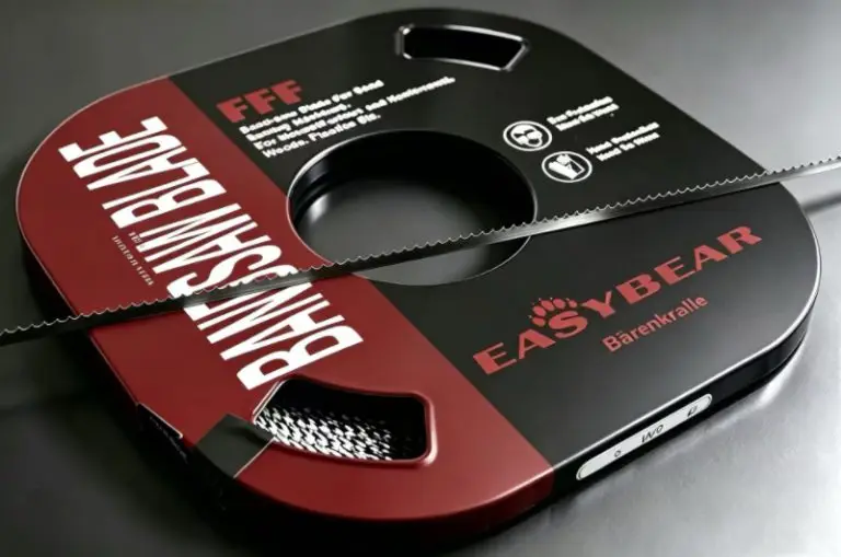Boxed carbon steel band saw blade with an unboxed coil on top showing tooth profile and blade details