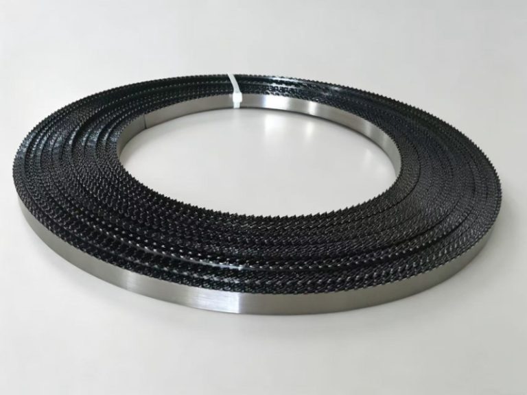 A coiled food band saw blade securely tied with cable ties