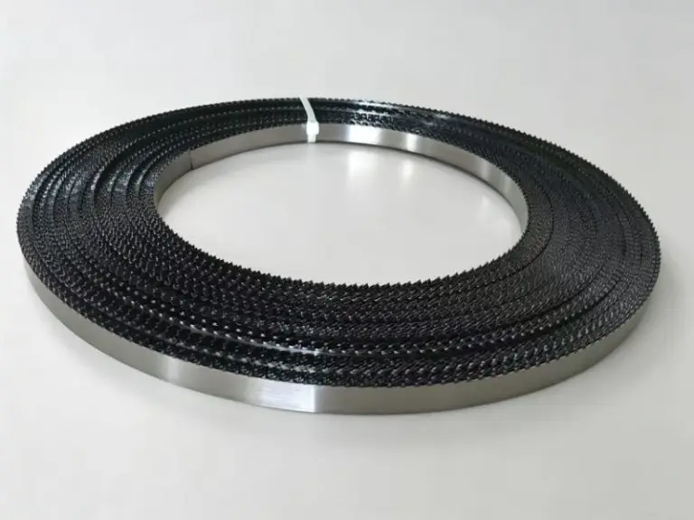 A coiled food band saw blade securely tied with cable ties